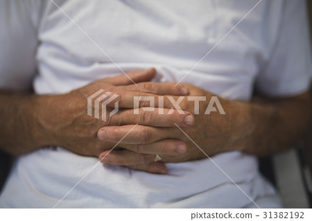 Senior man with hands clasped Senior man with hands clasped 31382192