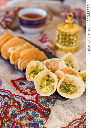 Traditional Arabic qatayf crepes stuffed cream 31382713