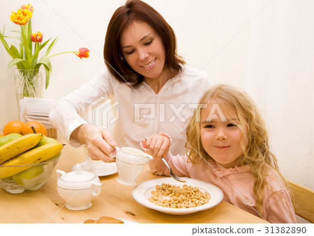 Mother and her daughter have a breakfast Mother and her daughter have a breakfast 31382890