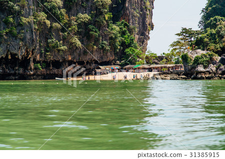 People on the island in Phang Nga Bay, Thailand People on the island in Phang Nga Bay, Thailand 31385915
