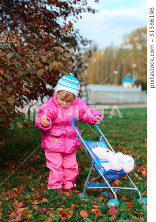 little girl playing with sidecar 31386196