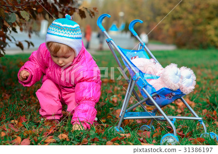 little girl playing with sidecar 31386197