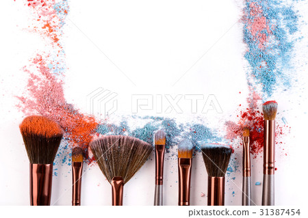 Makeup brushes with blush or eyeshadow of pink Makeup brushes with blush or eyeshadow of pink 31387454