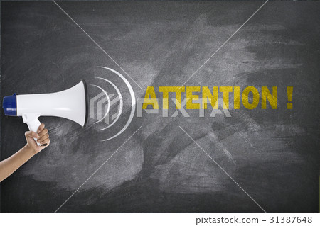 Megaphone with attention text on blackboard 31387648