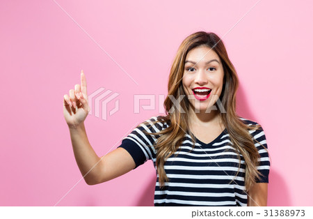 Young woman pointing something Young woman pointing something 31388973
