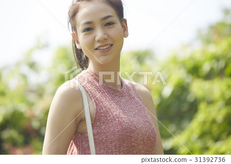close up portrait of young beautiful woman outdoor 31392736