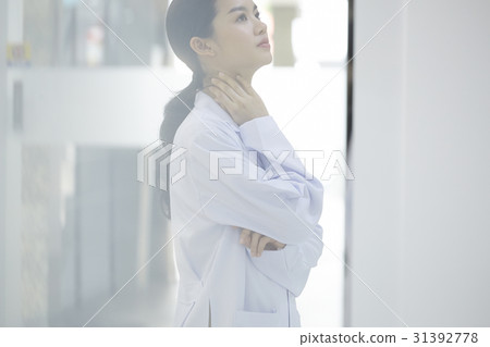 Female doctor is relaxing after a stressful working session 31392778