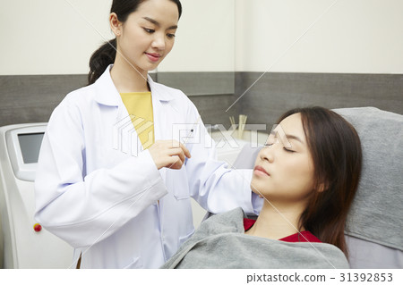 A young woman is ready to be injected botox into her face. A young woman is ready to be injected botox into her face. 31392853