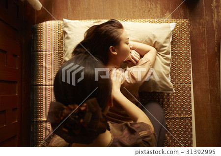 a woman is getting Thai massage in spa a woman is getting Thai massage in spa 31392995