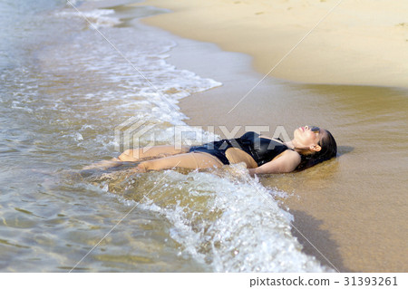 Lady relax on wave swimsuit Lady relax on wave swimsuit 31393261