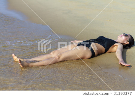 Lady body symbol relax on sand Lady body symbol relax on sand 31393377