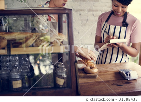 Men Checking Stock of Pastry in Bakery Shop Men Checking Stock of Pastry in Bakery Shop 31398435