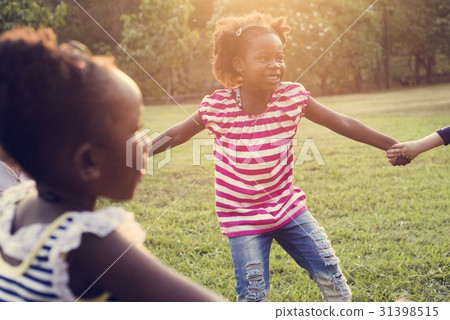 Happiness group of cute and adorable children playing in the par Happiness group of cute and adorable children playing in the par 31398515
