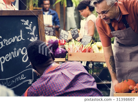 Adult Man Writing Grand Opening Sign 31398607