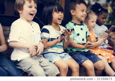 Group of Diverse Kids Using Mobile Phone Device Together 31398673