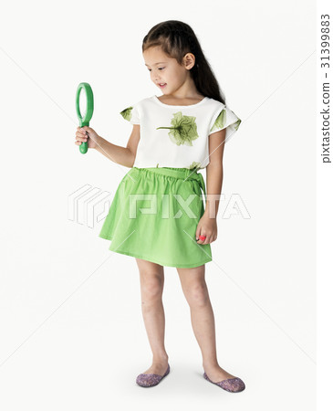 A girl is holding green magnifier A girl is holding green magnifier 31399883