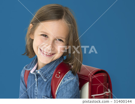 Young girl with a backpack cheerful studio portrait Young girl with a backpack cheerful studio portrait 31400144