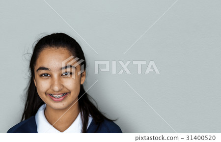 Portrait studio shoot of schoolgirl in uniform with smiling Portrait studio shoot of schoolgirl in uniform with smiling 31400520