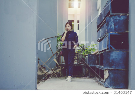 woman stands on the phone inside woman stands on the phone inside 31403147