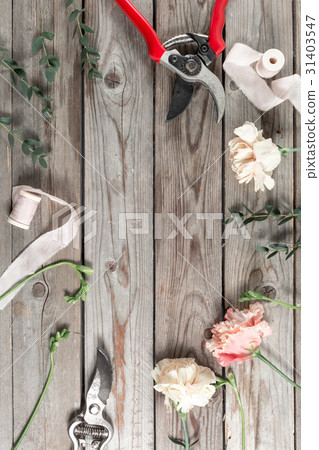 flowers and garden tools. The florist work table flowers and garden tools. The florist work table 31403547