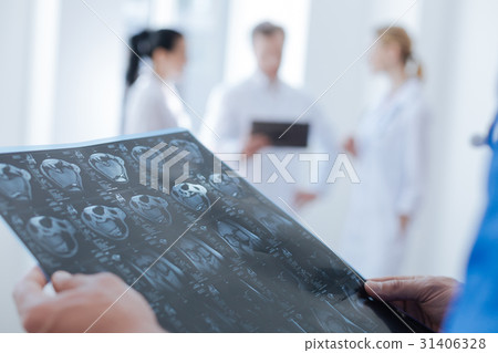 Professional radiologic technologist analyzing ct 31406328