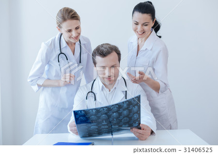 Positive radiologists discussing ct scan in the 31406525