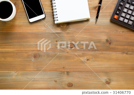 notepad on wooden office desk with smartphone 31406770