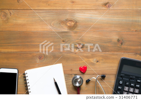 blank notepad on wooden desk with smartphone blank notepad on wooden desk with smartphone 31406771