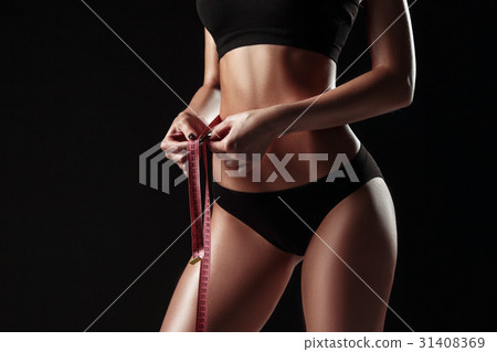 The fit woman measuring perfect shape of beautiful 31408369