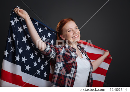 Portrait of young enthusiastic patriotic lady 31409844