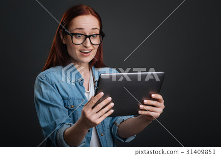 Emotional young woman impressed with something Emotional young woman impressed with something 31409851