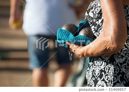 Hand of holding petanque ball Hand of holding petanque ball 31409957