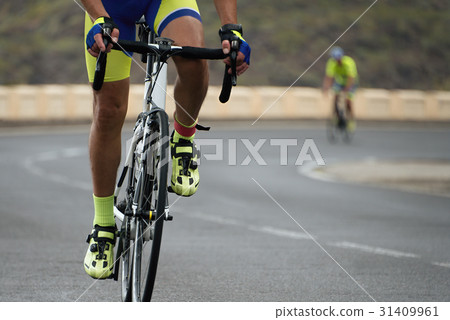 Cycling competition,cyclist athletes riding a race 31409961