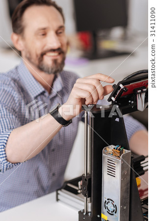 Selective focus of a designers hand pressing a Selective focus of a designers hand pressing a 31411090
