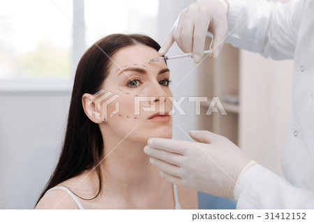Graceful young lady trusting her face to Graceful young lady trusting her face to 31412152