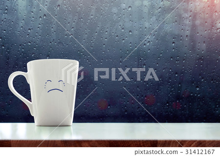 Sadness Coffee Mug with crying face on rainy day Sadness Coffee Mug with crying face on rainy day 31412167