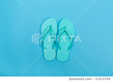 Beach sandals on a blue background Beach sandals on a blue background 31412436
