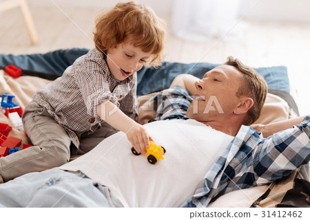 Relaxed male person lying on the bed 31412462