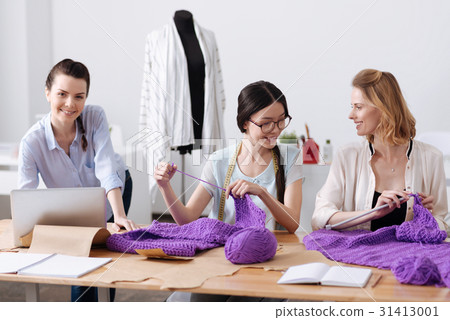 Pleasant tailors enjoying themselves while Pleasant tailors enjoying themselves while 31413001