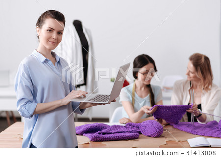 Atelier worker posing with a laptop 31413008