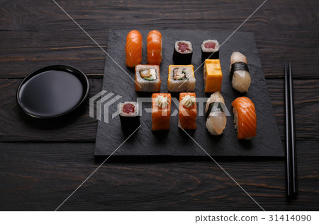 Sushi and rolls set in japanese restaurant on 31414090