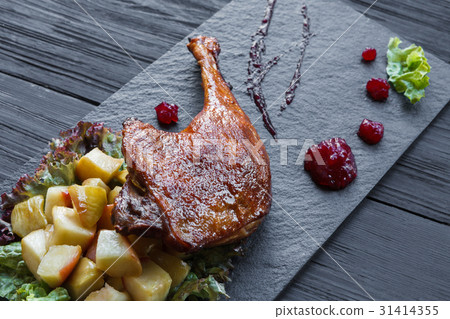 Roasted duck leg, restaurant food closeup 31414355