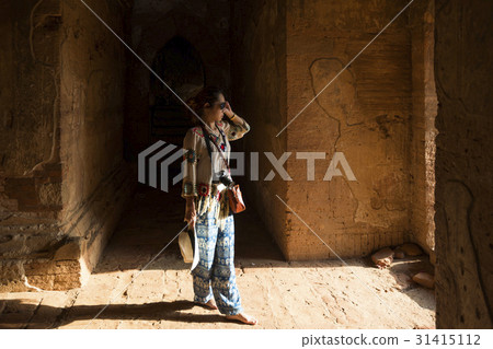 Woman inside Dhammayangyi Pagoda, Bagan, Myanmar Woman inside Dhammayangyi Pagoda, Bagan, Myanmar 31415112