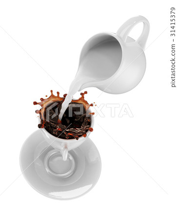 Milk being poured into small cup of coffee Milk being poured into small cup of coffee 31415379