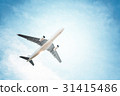 Airplane in the sky and clouds 31415486