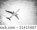 Airplane in the sky and clouds 31415487