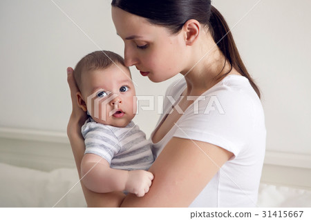 mother with her newborn son in hands mother with her newborn son in hands 31415667