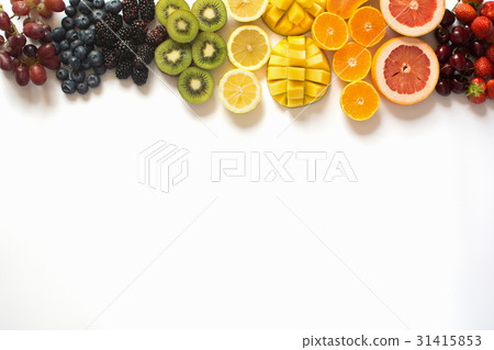 Top view of rainbow fruits on white 31415853