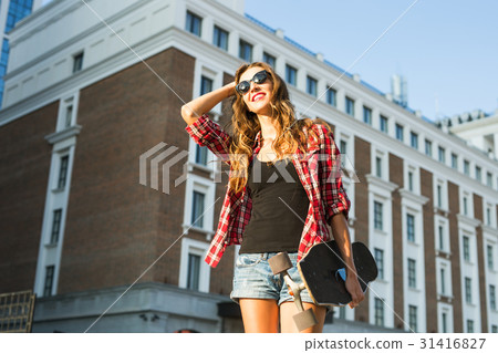 Beautiful young woman in sunglasses with skate Beautiful young woman in sunglasses with skate 31416827