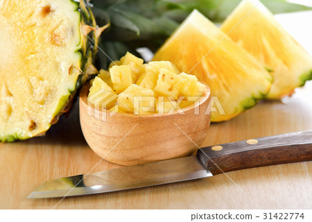 pineapple sliced on wood background pineapple sliced on wood background 31422774